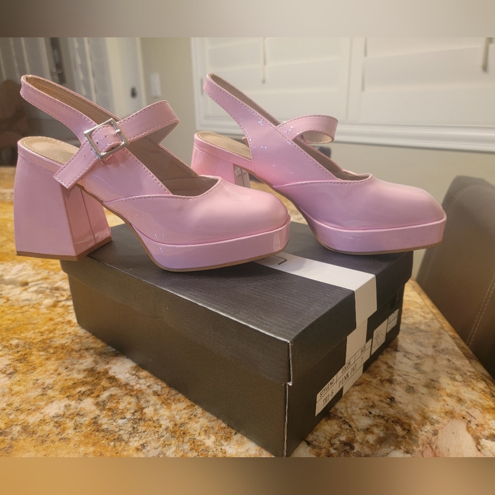 Size 7 pink heels. -SOLD